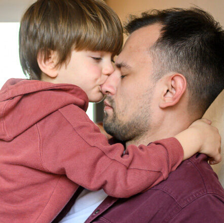 Son kiss his father 